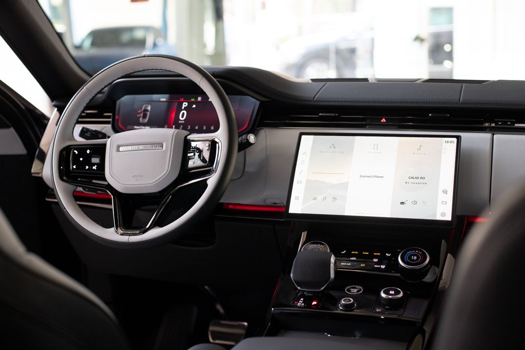High-end car interior featuring modern digital dashboard and steering wheel.